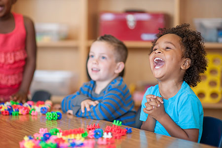 Children laughing in preschool